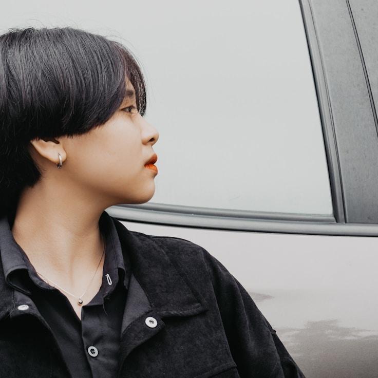 Kaveri Mehta, Lead Design Curator at MirrorSimpleCloud, reviewing corporate floral arrangements